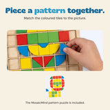 A hand places a blue tile in the MosaicMind wooden grid, with the matching picture card below.