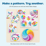 Ideas for rearranging the curved Ocean Spiral puzzle pieces into colourful patterns