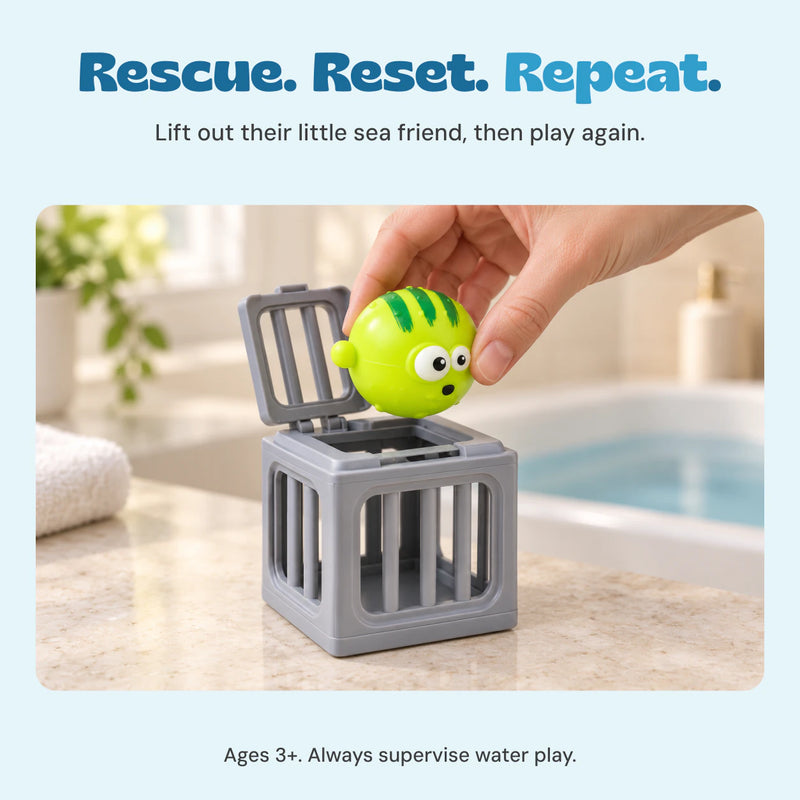 An adult hand lifts one green puffer toy from the open hinged top of its gray rescue cage. Ages 3+. Adult supervision required for water play.