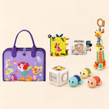 Mermaid Purple Plus busy board with a busy cube, Garden Fun cloth book, Animal lion soft book, giraffe rattle and three turtle bath toys on a pale beige background.