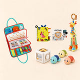 Rocket Green Plus busy board with a busy cube, Garden Fun cloth book, Animal lion soft book, giraffe rattle and three turtle bath toys on a pale beige background.