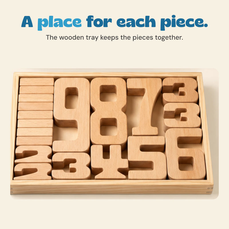 Close view of natural wooden numbers arranged inside their rectangular wooden storage tray.