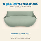 Close view of the sage silicone bib catch pocket and curved sides.