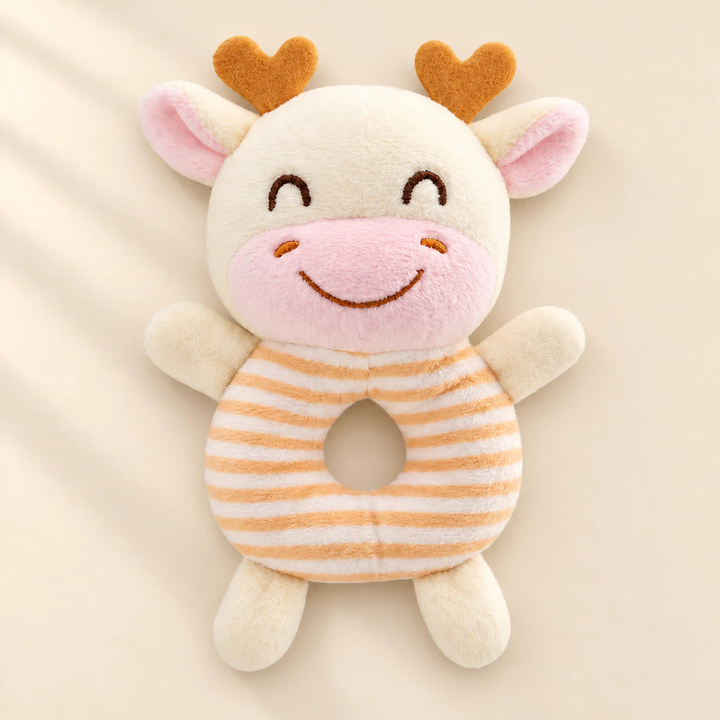 Burnt Orange rattle friend: cream cow with orange horns and orange striped ring body.