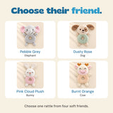 Four available rattle friends: Pebble Grey elephant, Dusty Rose dog, Pink Cloud Plush bunny and Burnt Orange cow. Choose one rattle.