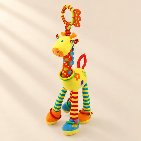 Yellow giraffe rattle with patterned red neck, striped legs, coloured rings and an orange and lime hanging loop.