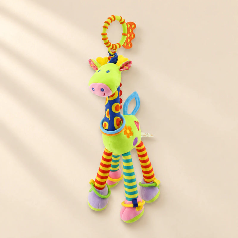 Green giraffe rattle with patterned blue neck, striped legs, coloured rings and an orange and lime hanging loop.