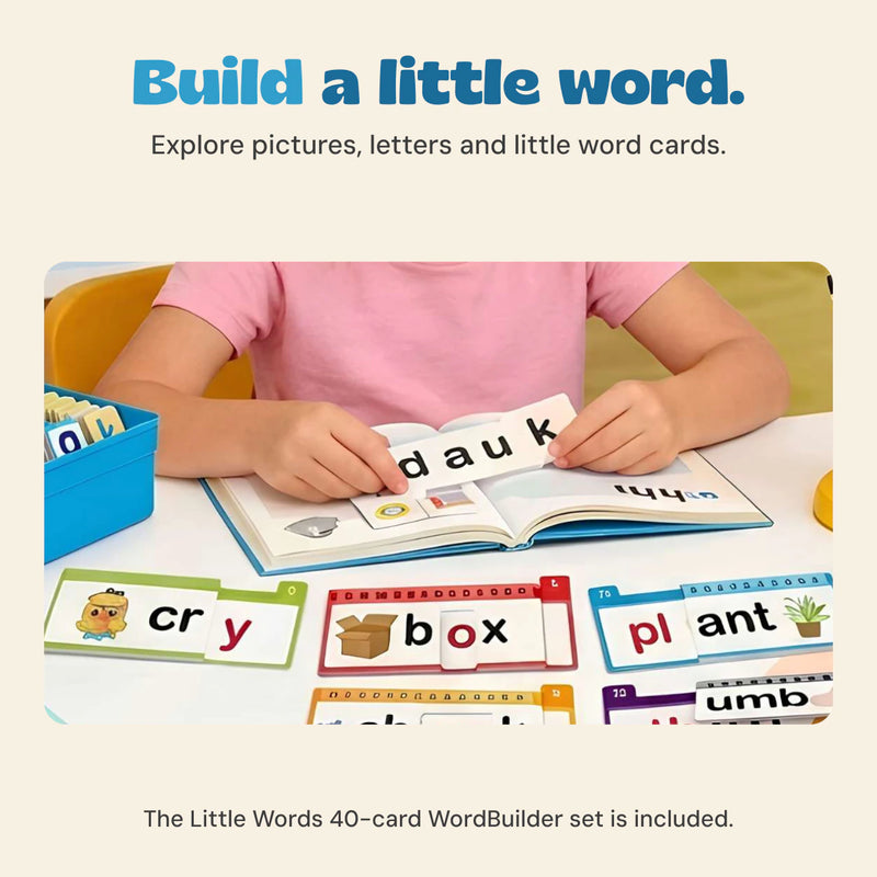 A child uses word cards at a table beside the blue WordBuilder box.