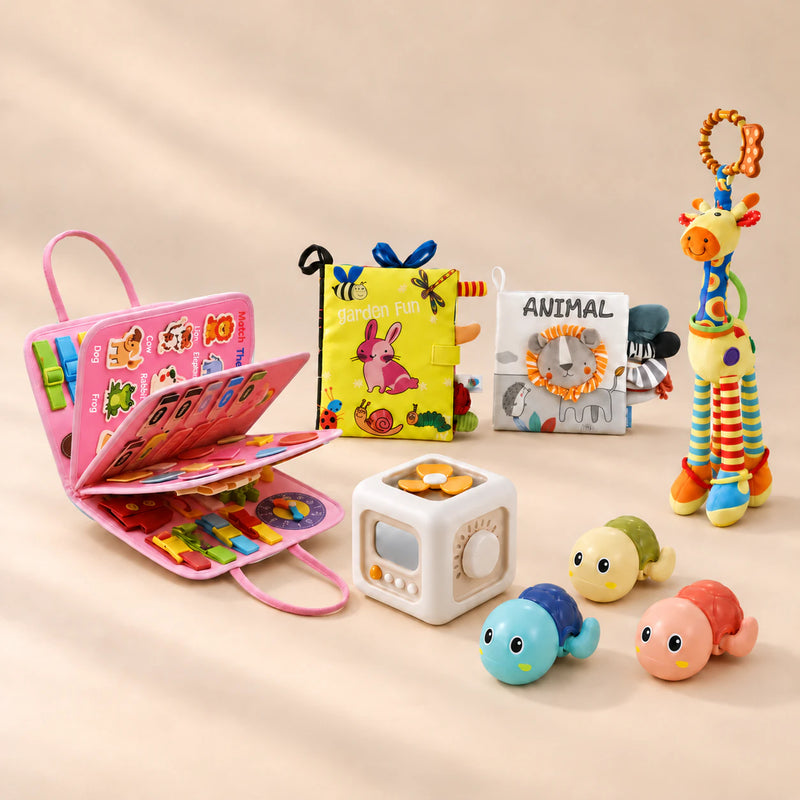 No-Screen Starter Kit Bundle with pink activity board, sensory books, giraffe, busy cube and three turtles in a warm beige studio
