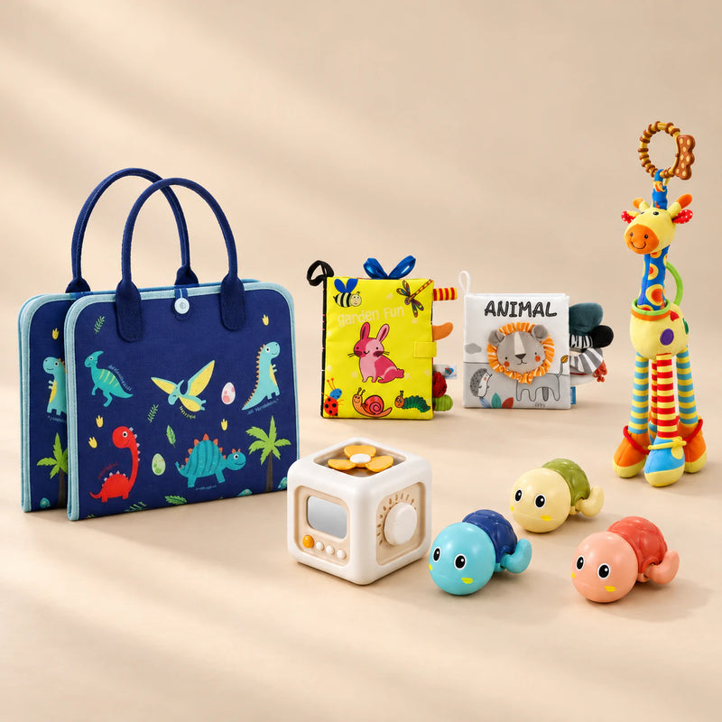 No-Screen Starter Kit Bundle with its matching busy board, cloth books, busy cube, giraffe rattle and three turtle toys on a warm beige studio surface.