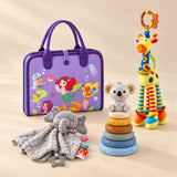 Calm and Focus Bundle with a closed purple mermaid busy board, elephant comforter, giraffe rattle and six-ring koala stacker on a beige studio surface.