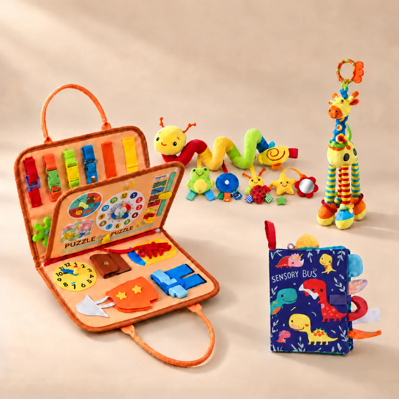 Sensory Explorer Bundle with orange busy board, dinosaur sensory book, colourful spiral activity toy and giraffe on a warm beige studio surface