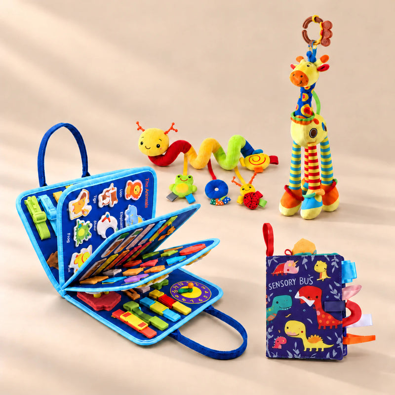 Vehicle Blue Plus busy board with a dinosaur sensory book, giraffe rattle and spiral toy on a warm beige studio floor.