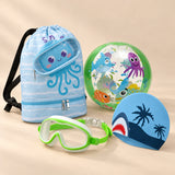 Holiday Summer Bundle, Green colour choice, with backpack, goggles, swim cap and beach ball on a warm beige studio surface.