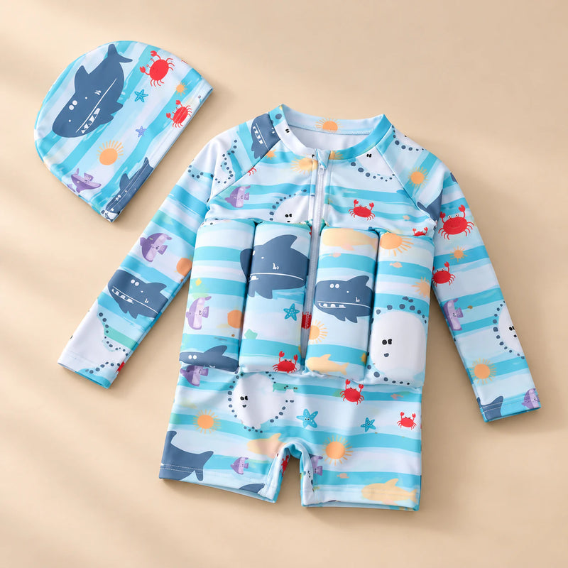 TibaToes™ FloatPal Kids Buoyancy Swimsuit photographed with its matching design and colours on a warm beige studio surface.