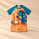 TibaToes™ FloatPal Kids Buoyancy Swimsuit photographed with its matching design and colours on a warm beige studio surface.