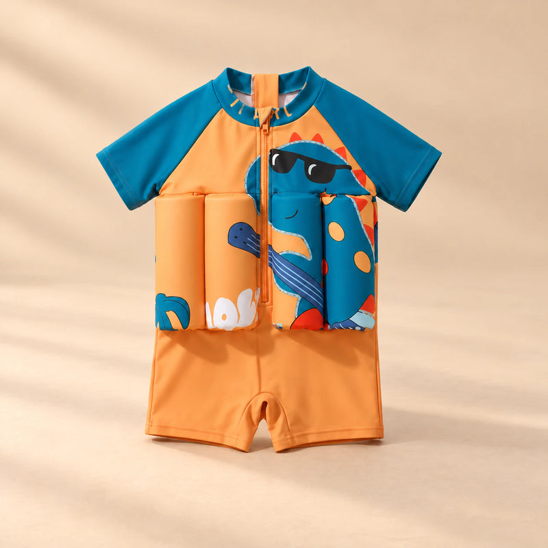 TibaToes™ FloatPal Kids Buoyancy Swimsuit photographed with its matching design and colours on a warm beige studio surface.