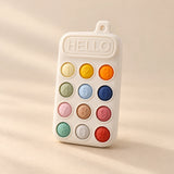 Click & Calm Silicone Phone Teether on a warm beige studio background in Vanilla Cream