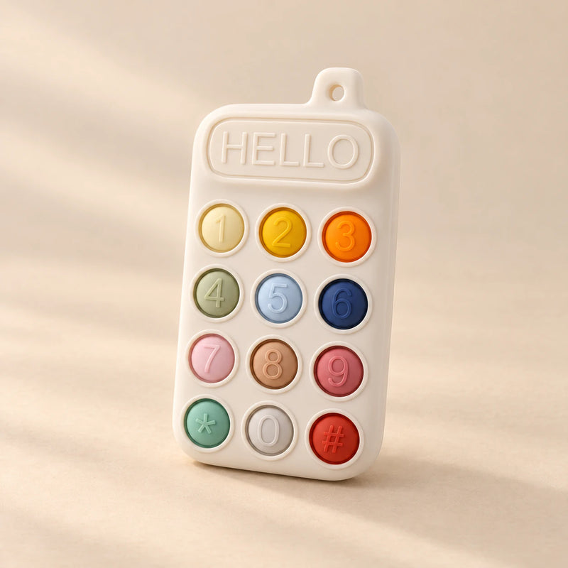 Click & Calm Silicone Phone Teether on a warm beige studio background in Vanilla Cream