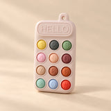 Click & Calm Silicone Phone Teether on a warm beige studio background in Blush Pink