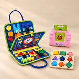 Focus Foundations Bundle with Dinosaur Blue busy board, pink talking flashcard reader and wooden shape puzzle on a warm beige studio surface.