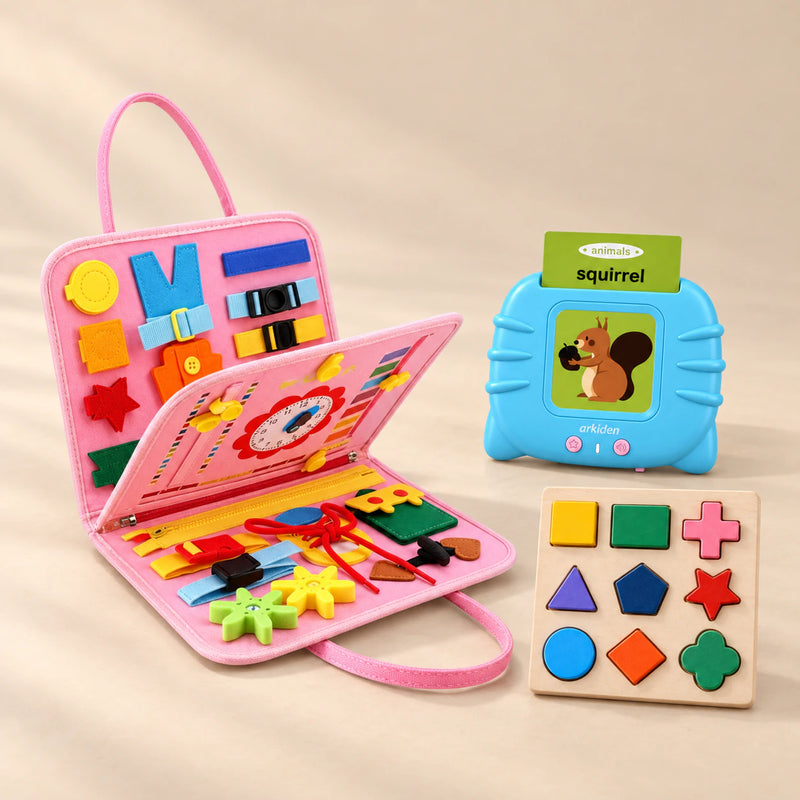 Focus Foundations Bundle with its colour-matched busy board, talking flashcards and shape puzzle on a warm beige studio surface.