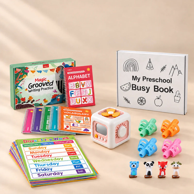 Kindergarten Readiness Bundle with busy cube, Preschool Busy Book, six writing books, learning posters and pencil grips on a warm beige studio surface.