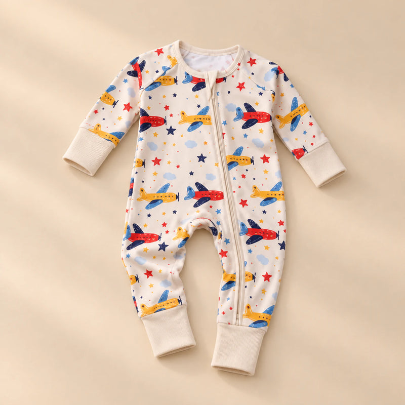 Soft Zip Baby Romper, showing its actual design with soft shadows on a seamless warm beige studio surface.