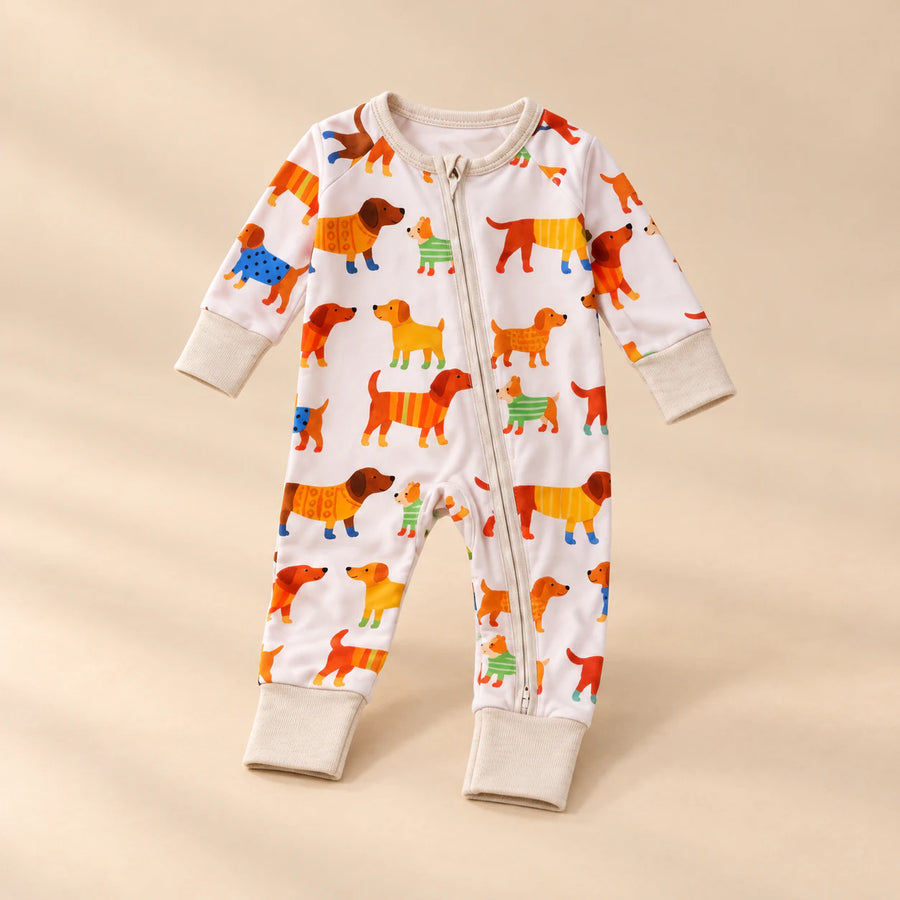 Soft Zip Baby Romper, showing its actual design with soft shadows on a seamless warm beige studio surface.