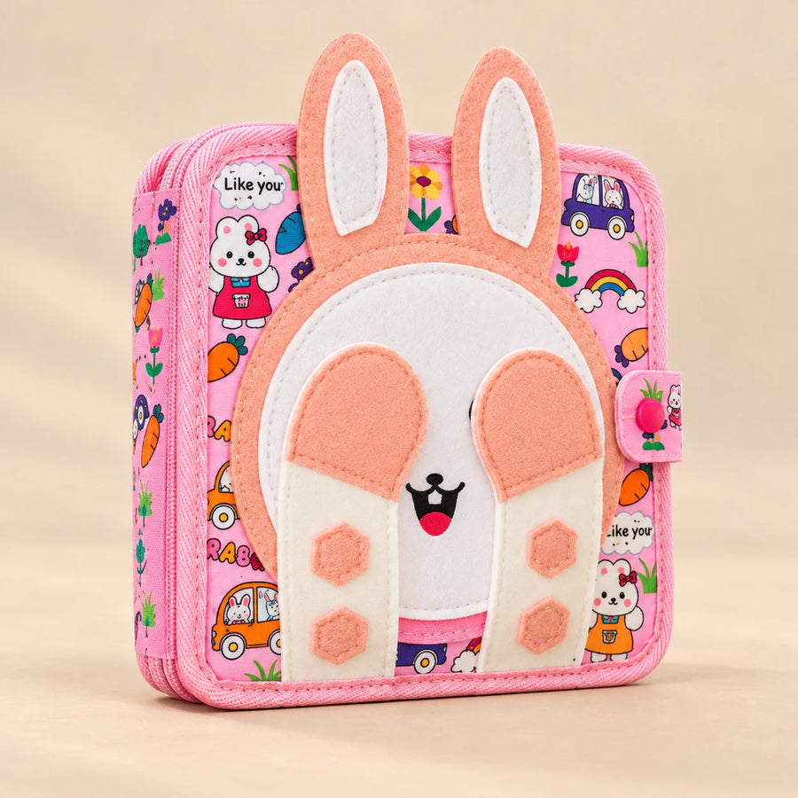 Bunny Busy Book, showing its actual design with soft shadows on a seamless warm beige studio surface.