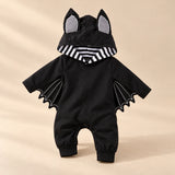 Little Bat Hooded Romper on a warm beige studio background in Classic Bat Romper
