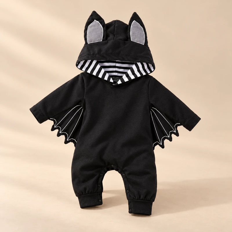 Little Bat Hooded Romper on a warm beige studio background in Classic Bat Romper