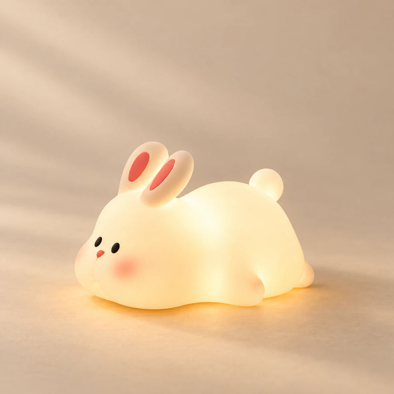 CuddleGlow Animal Night Light on a warm beige studio background in Bunny Glow Light