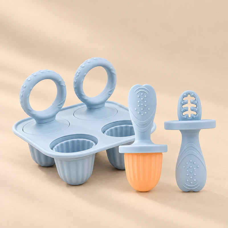 Little Bites Silicone Feeder & Teether Set on a warm beige studio background in Sky Blue Set
