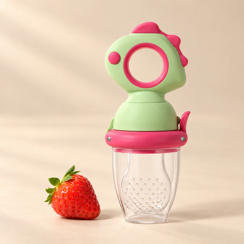 Dino Fresh Food Feeder on a warm beige studio background in Berry Pink Dino