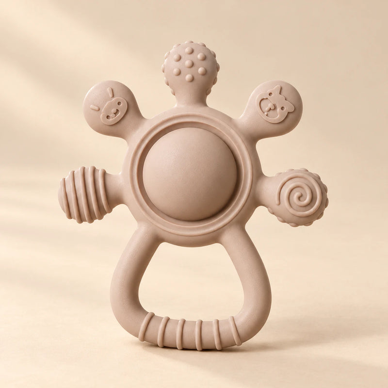LittleGrip Silicone Teether Rattle on a warm beige studio background in Mocha Beige Teether