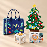 TibaToes™ Christmas Wonder Play Bundle with Dinosaur Blue Plus products arranged on a warm beige studio surface.