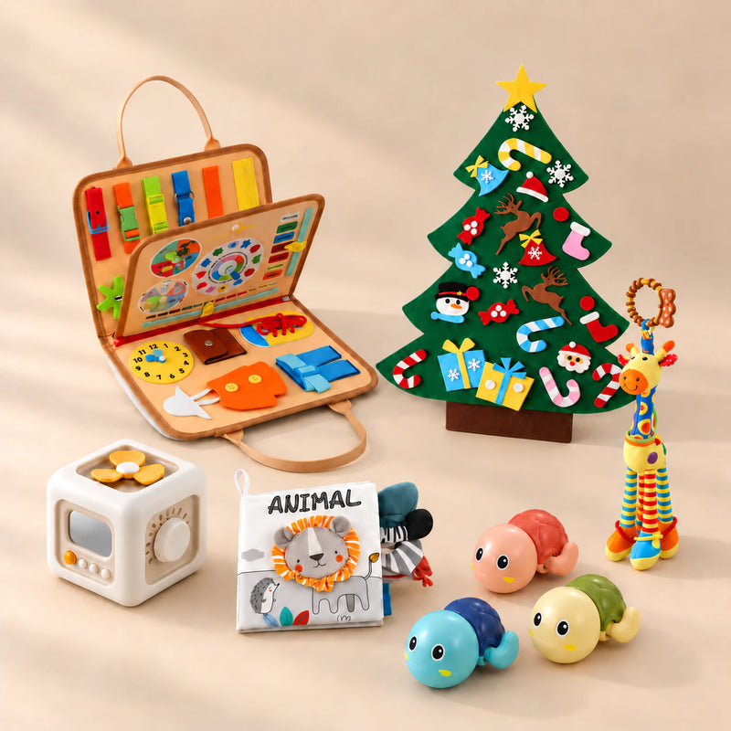 Christmas Wonder Learning Bundle with orange animal busy board, decorated felt Christmas tree, busy cube, sensory book, giraffe and turtle toys on a warm beige studio surface