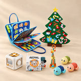 Christmas Wonder Learning Bundle with the Vehicle Blue Plus busy board, arranged on a warm beige studio surface.