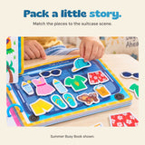 Original hand placing a cap piece on the Summer Busy Book suitcase activity, with clothes and holiday pictures.