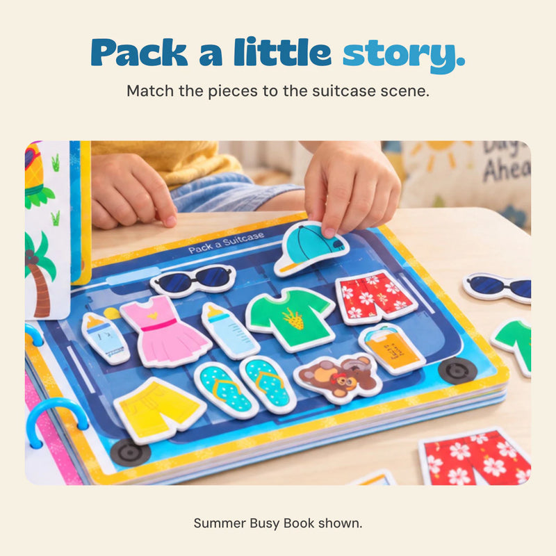 Original hand placing a cap piece on the Summer Busy Book suitcase activity, with clothes and holiday pictures.