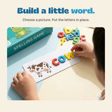 Original close-up shows the cow picture card with red c, blue o and yellow w being placed by hand.