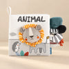 A lion with a striped fabric mane on the Animal sensory cloth book.