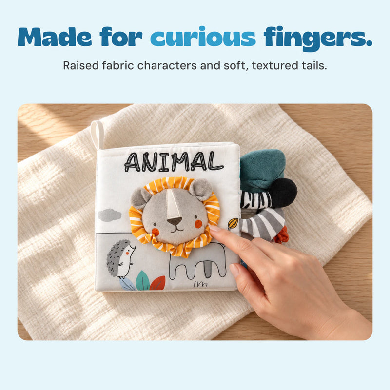 A hand touches the striped fabric mane on the Animal cloth book.