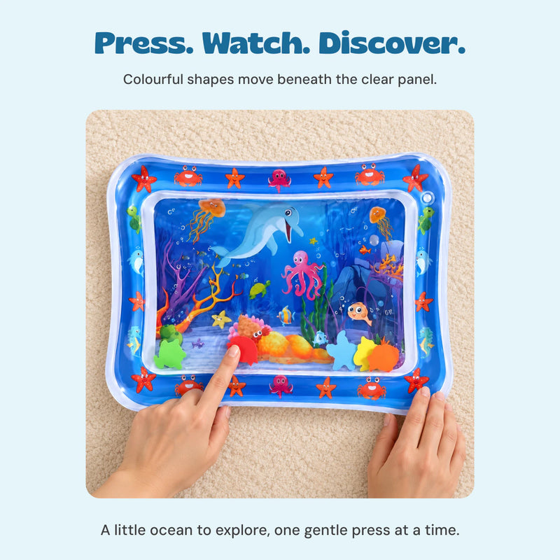 Adult hands gently pressing the clear water-filled ocean mat.