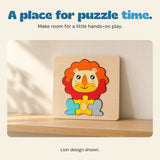Assembled Lion wooden puzzle resting on a pale oak shelf against a warm neutral wall.