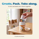 Hand placing the clear lid over the twelve crayons in the giraffe carrying tub, with its white strap on a wooden table.