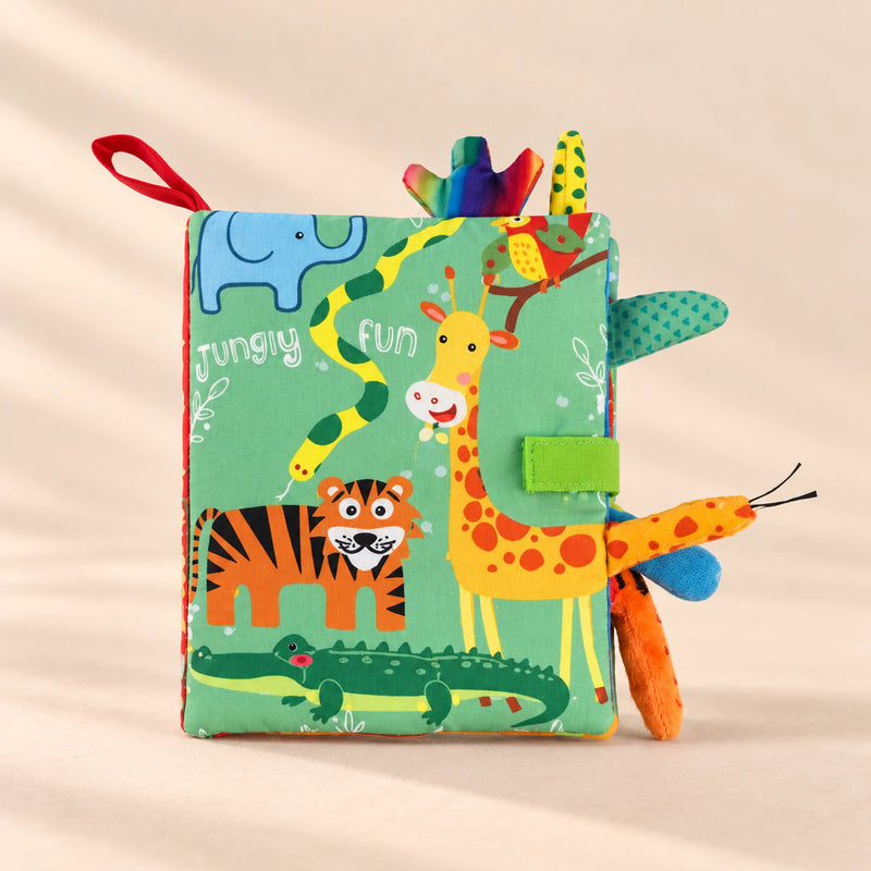 TibaToes Snuggle Stories Jungle Fun cloth sensory book on a warm beige background.