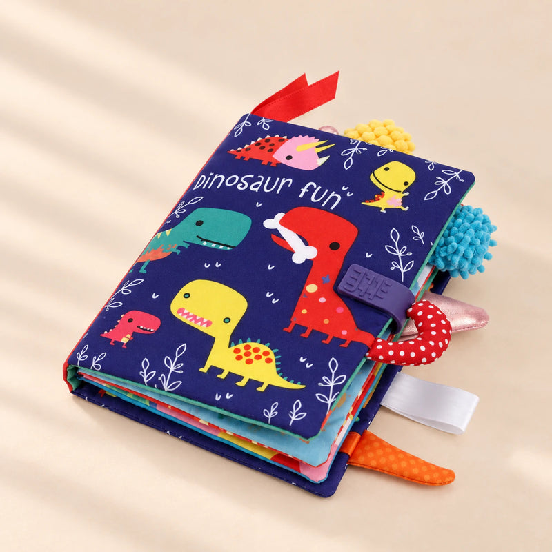 TibaToes Snuggle Stories Dinosaur Fun cloth sensory book with colourful fabric tabs.