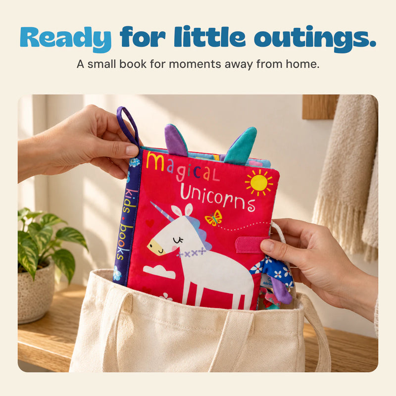 Hands placing the Magical Unicorn sensory book into a canvas tote.